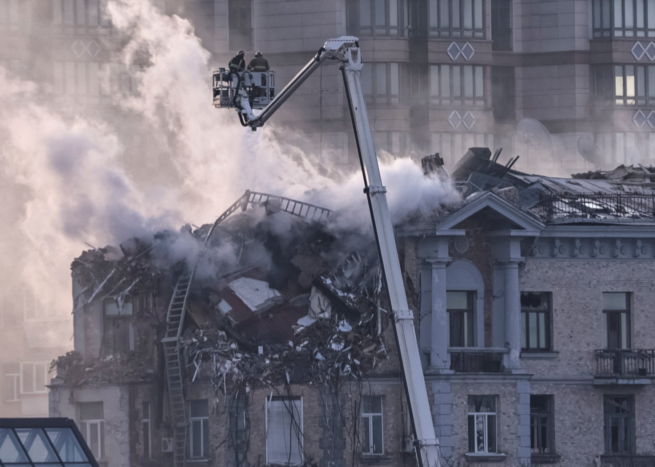 Missile and drone strikes on Kyiv kill six and injure dozens as pressure mounts on Moscow to halt attacks. Ukrainian officials warn the death toll may rise as rescue efforts continue.